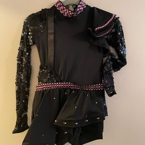 Child size black fully rhinestoned jazz costumes with pink and clear stones.